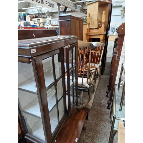 965 - Various items of furniture; mahogany display cabinet, walnut coffee table, rocking chairs, occasiona... 