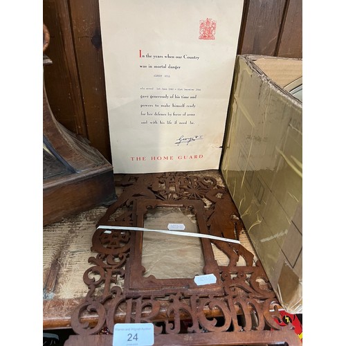 24 - A wooden picture frame depicting military, together with a certificate of Home Guard service