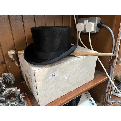 35 - A Christys dressage top hat size 6.5 (never worn) and a riding crop.