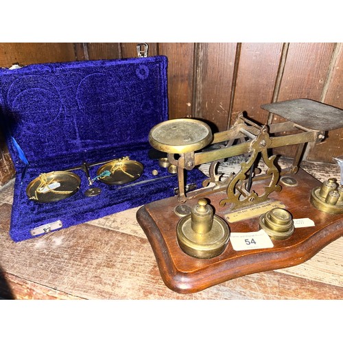 54 - A set of Post Office scales with weights, and a cased brass balances with weights and tweezers