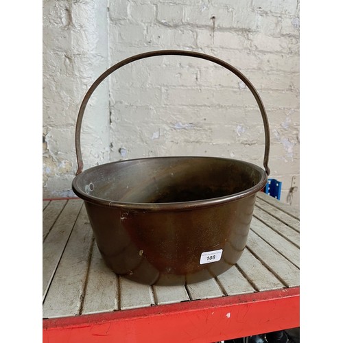 108 - A copper jam pan and approx 40 wicker planter holders