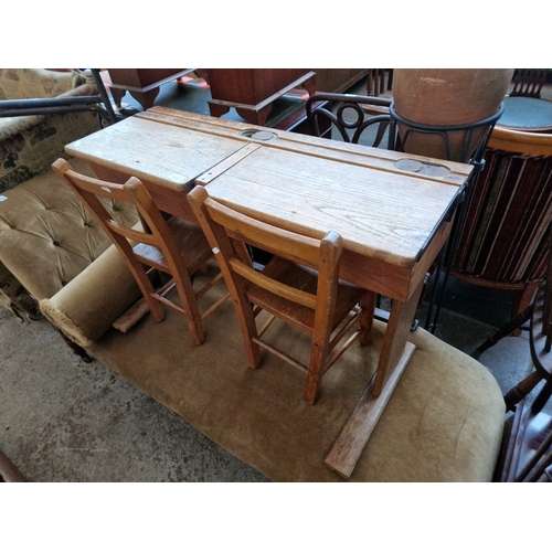 988 - A child's double primary school desk and two chairs circa 1920s.