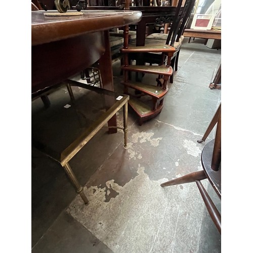 920 - A set of library steps and two brass and glass top tables.