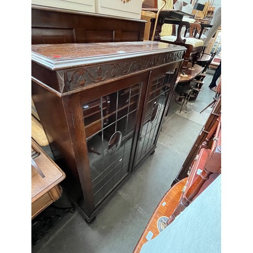 914 - A 1920s oak and leaded glass bookcase.