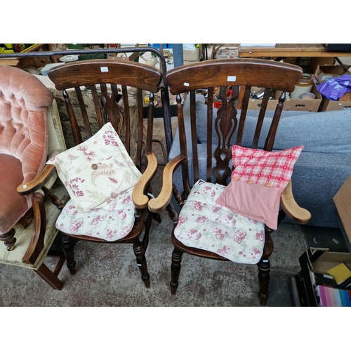 1000 - A pair of stained beech farmhouse chairs.