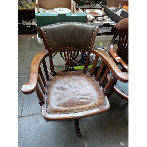 1001 - An early 20th century captain's chair with silver plaque for 1912.