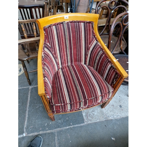 994 - A modern tub chair with striped upholstery.