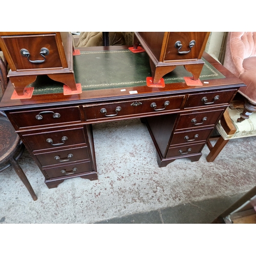 997 - A mahogany kneehole desk.