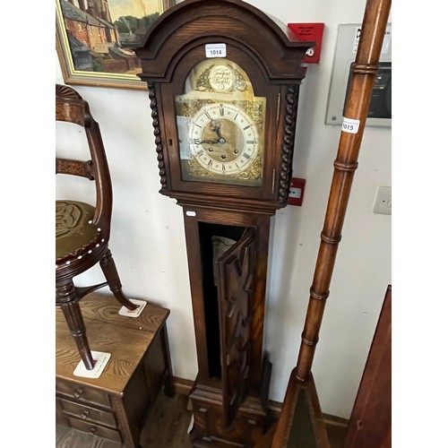 1014 - A grandaughter chimimg clock in geometric oak case, with pendulum, keys & bill of sale.