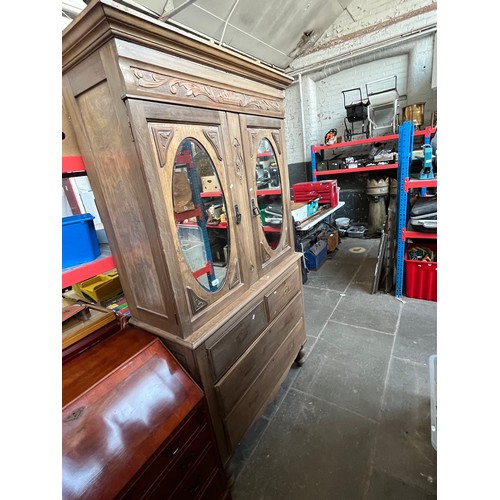 1007 - An Edwardian beech linen press with mirrored doors to the top.