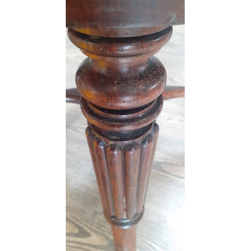 1012 - A 19th century inlaid rosewood adjustable piano stool.