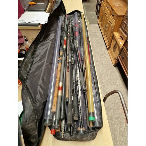 130 - A collection of coarse fishing tackle including carbon pole, carp rods, spinning rod, whips, pole ro... 