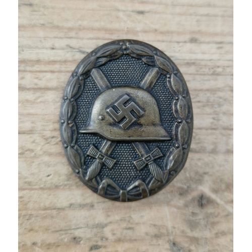 55 - A German WWII Wound badge, hollow back.