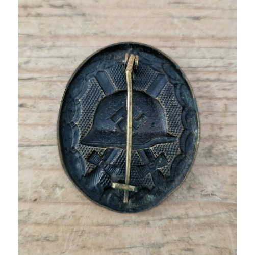 55 - A German WWII Wound badge, hollow back.