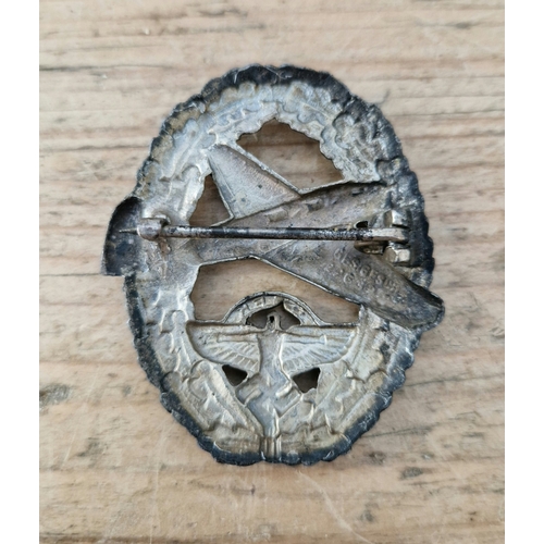 58 - A German WWII NSFK Pilots badge for Powered Aircraft, hollow back example with pin and catch fixing ... 