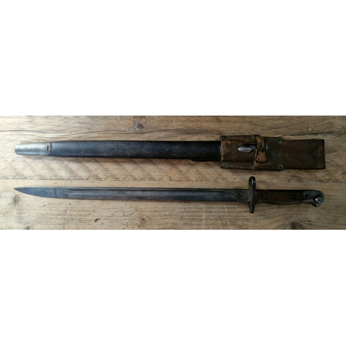 69 - A WW1 British Wilkinson bayonet, pattern 1907 ( Mark I ), with leather and metal scabbard, leather f... 