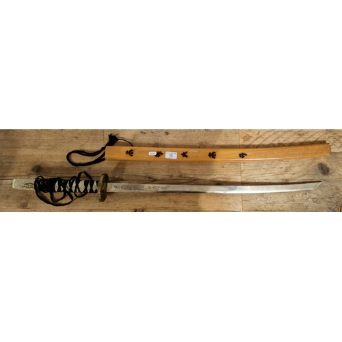 73 - A reproduction katana sword in wooden scabbard.