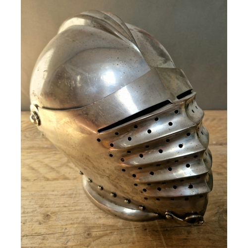 74 - A Victorian reproduction of a German Maximilian style helmet with hinged up visor and side plates.