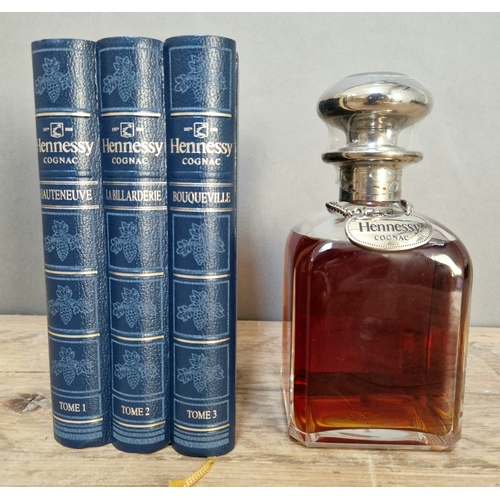 93 - A bottle of Hennessy Cognac, Decanter, 40% vol, 70cl, in a book style blue presentation case.