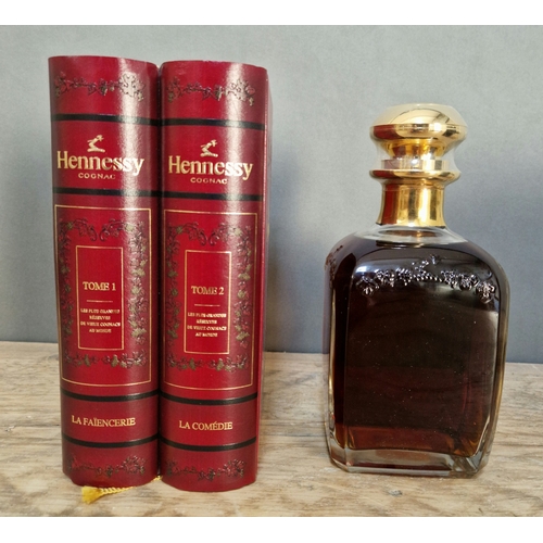 94 - A bottle of Hennessy Cognac, Decanter, 40% vol, 70cl, in a book style red presentation case.