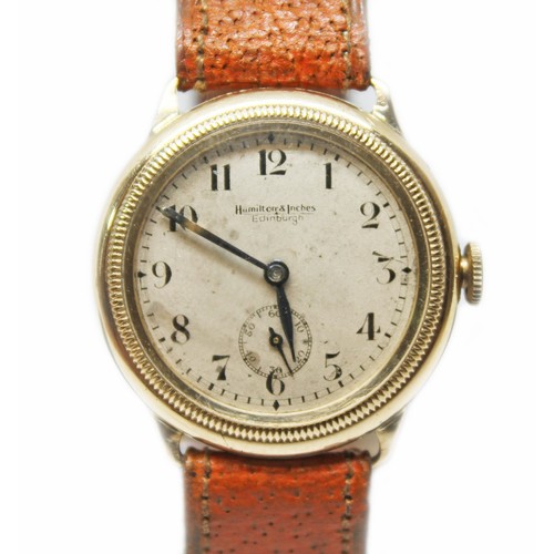 47 - A Hamilton & Inches 9ct gold wristwatch, circa 1935, case diam. 32mm, signed silvered dial with Arab... 