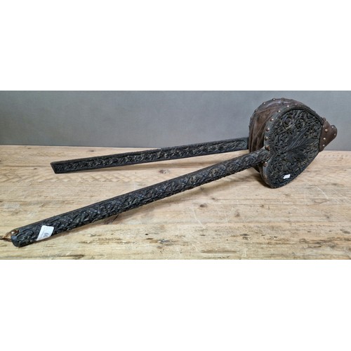 99 - A 19th century Anglo Indian carved ebonised wood and studded leather bellows.