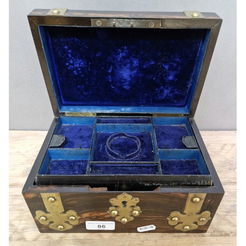 86 - A 19th century coromandel and brass bound jewellery box.