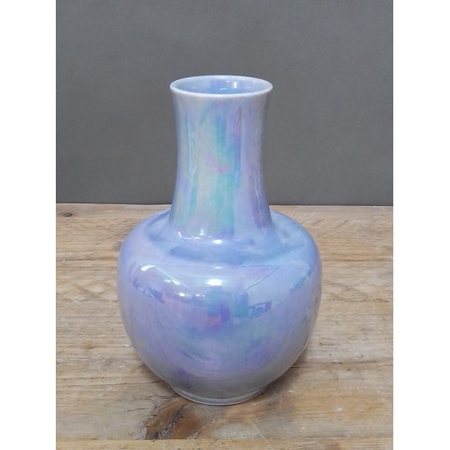 122 - A Ruskin lustre bottle vase, dated 1923, height 24cm.