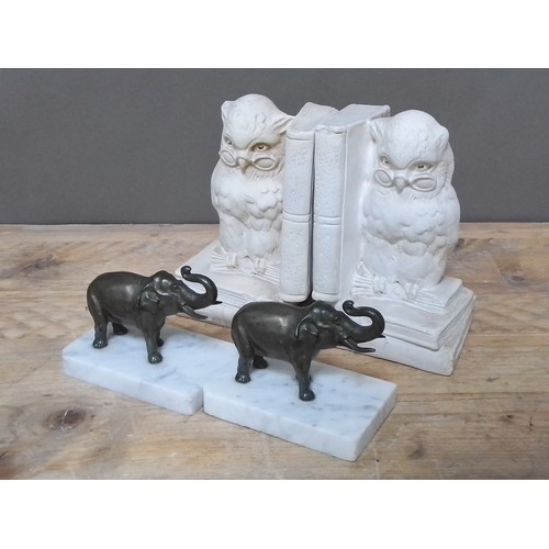 104 - A pair of spelter elephants on marble bases and a pair of plaster owl bookends, length 13cm & 11cm r... 