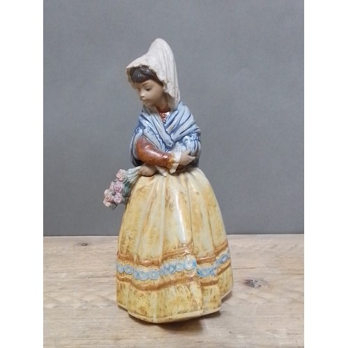 120 - A Lladro porcelain figue, height 34cm.