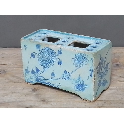 113 - An English 18th century delft flower brick, length 20cm.