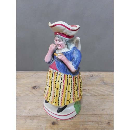 108 - A Staffordshire pottery toby jug depicting a female snuff taker, circa 1840, height 27.5cm.