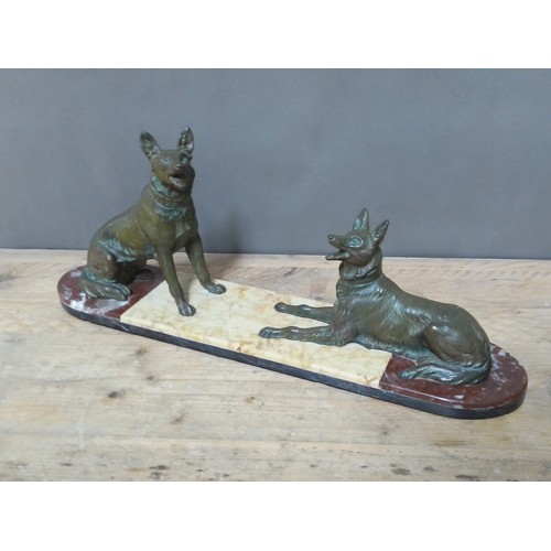 174 - An Art Deco cast spelter figure of two dogs on marble base, length 66cm.