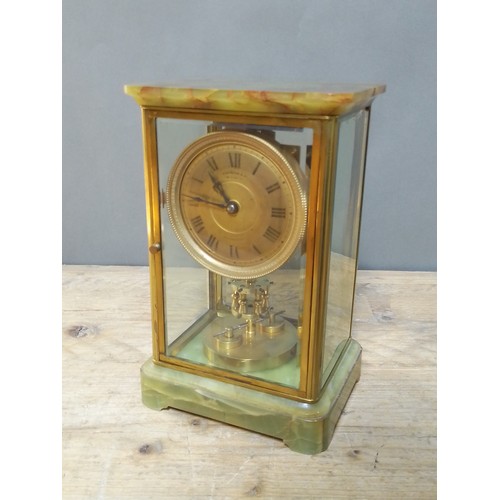 177 - A late 19th century green onyx torsion clock, signed Boddington & Co, Manchester, height 26.5cm.