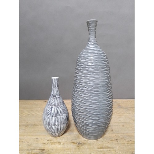 134 - A pair of modern vases by Kelly Koppen, height 30cm & 54cm.