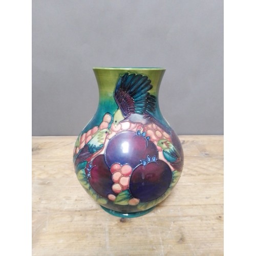 135 - A Moorcroft pottery vase, height 23cm.