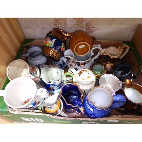 167 - A box of assorted pottery mugs and jugs.