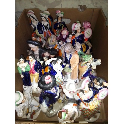 188 - A box of Staffordshire pottery figures.