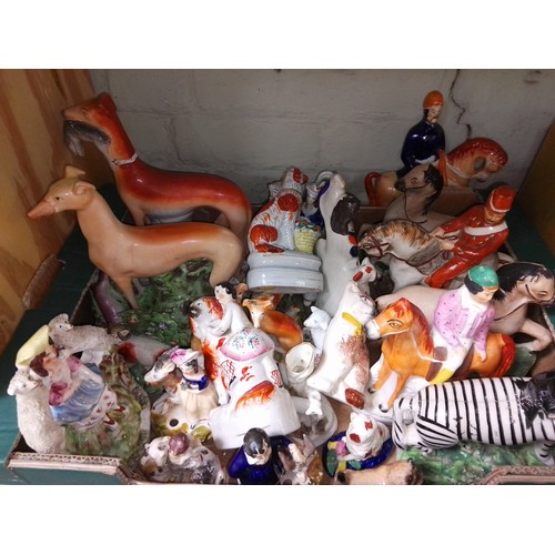 158 - A box of assorted Staffordshire pottery horses and dog figures.