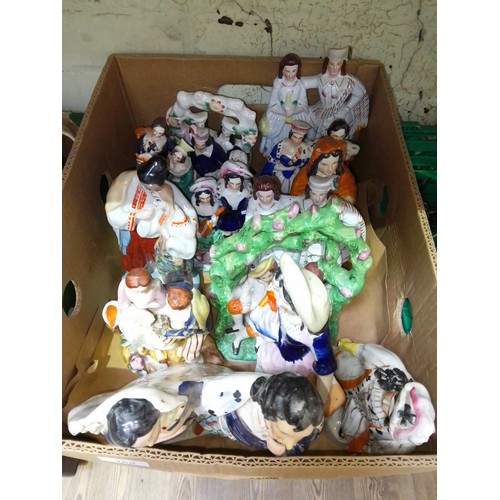 168 - A box of Staffordshire pottery figures.