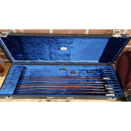 202 - A case containing eight violin bows, various conditions, all missing hairs.