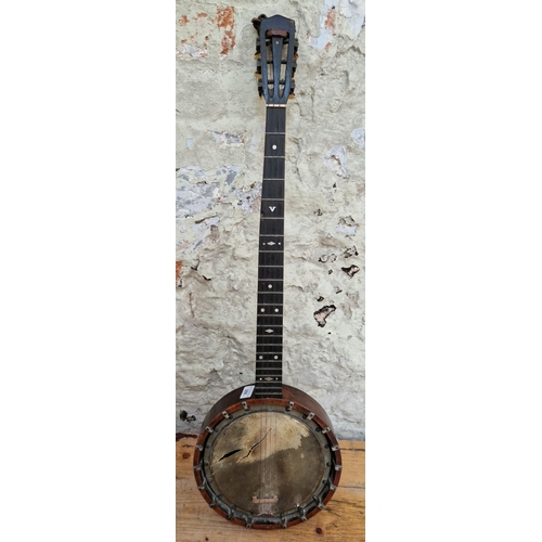 206 - A vintage B.B. Mandard Quality four string banjo.