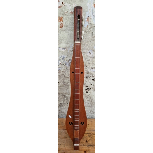 207 - A four string Appalachian style dulcimer/folk instrument.