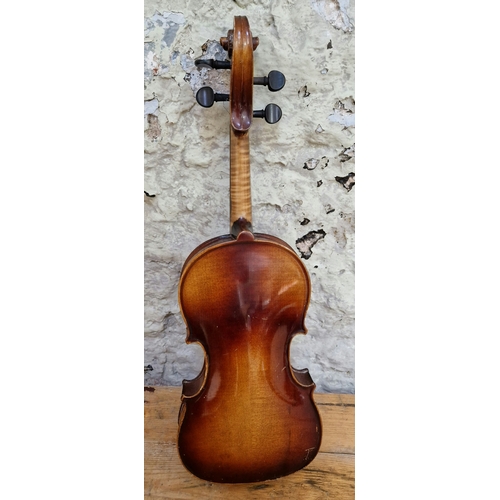 208 - A German violin, labelled 'Copy of Antonius Stradivarius', two piece back, length 395mm, with case.