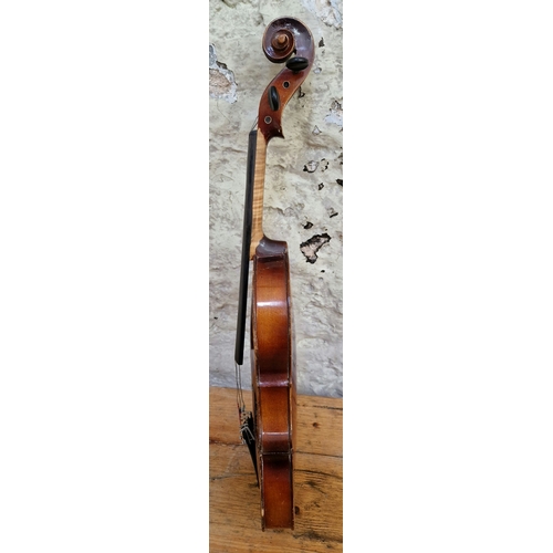 208 - A German violin, labelled 'Copy of Antonius Stradivarius', two piece back, length 395mm, with case.