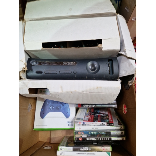 247 - A box containing an Xbox 360, Xbox wireless controller, assorted 360 games, assorted PS3 games & a S... 