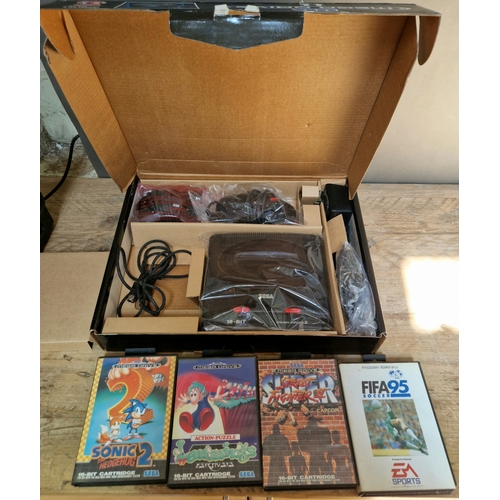 248B - A boxed 16bit Sega Megadrive II together with 4 games including Street Fighter II.