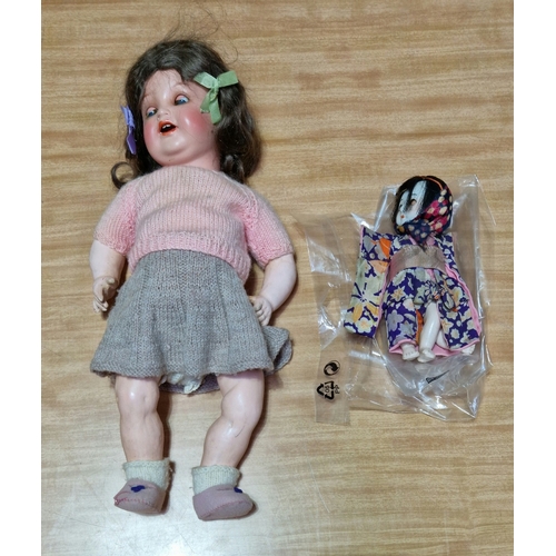 252 - Two vintage dolls; 1930s Singer doll 'Jeannette' and a Japanese Geisha doll of a similar age.