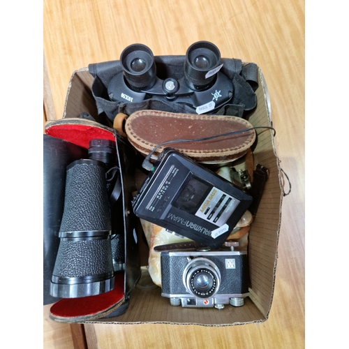 262 - A pair of Delmar Paris binoculars in case together with a pair of Super Zenith binoculars, another p... 