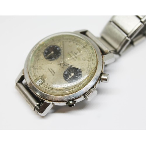 15 - A Dugena stainless steel chronograph wristwatch, circa 1970, diam. 38mm, silvered dial with two blac... 